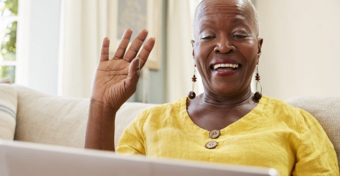 Senior Woman Using Laptop To Connect With Family For Video Call